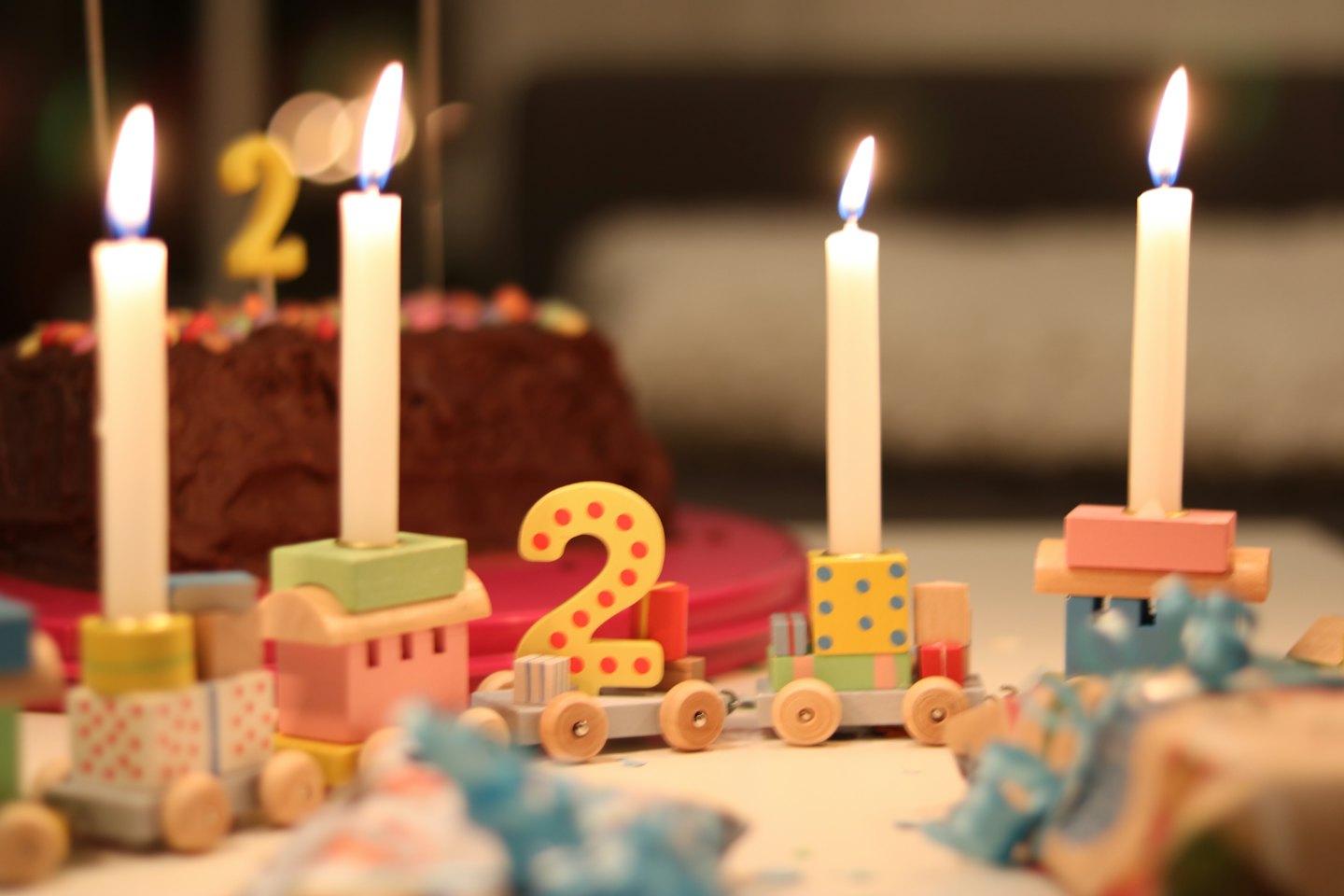 A chocolate birthday cake with a number two candle.